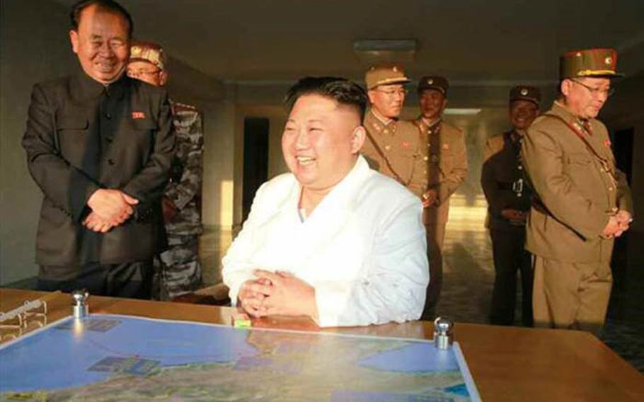 North Korean leader Kim Jong Un shown observing missile test in photos published May 30, 2017, in Rodong Sinmun, the official organ of the ruling Workers' Party. The photos did not include a caption but accompanied a story about a launch the day before of a reported short-range missile.