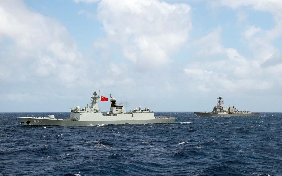 The Chinese frigate Hengshui and the guided-missile destroyer USS Stockdale transit in formation during Rim of the Pacific 2016. China has been invited back for RIMPAC 2018, despite recent incidents with U.S. ships and aircraft. 
Ryan J. Batchelder/U.S. Navy