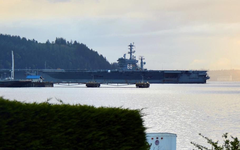 The aircraft carrier USS Nimitz sails in Puget Sound on April 28, 2017, on its way to homeport Naval Base Kitsap-Bremerton, Wash., after finishing its final pre-deployment assessment.
