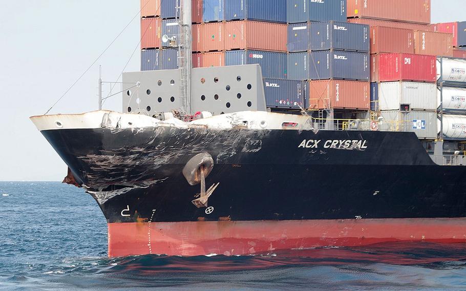Damage to the Philippine-registered container ship ACX Crystal is seen in the waters off Izu Peninsula, southwest of Tokyo, after it collided with the USS Fitzgerald, Saturday, June 17, 2017