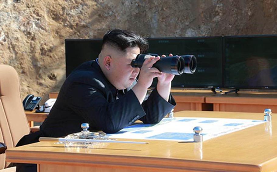 Photos published by the state-run Korean Central News Agency purportedly show North Korean leader Kim Jong Un watching what North Korea claims was its first successful test of an intercontinental ballistic missile on July 4, 2017.