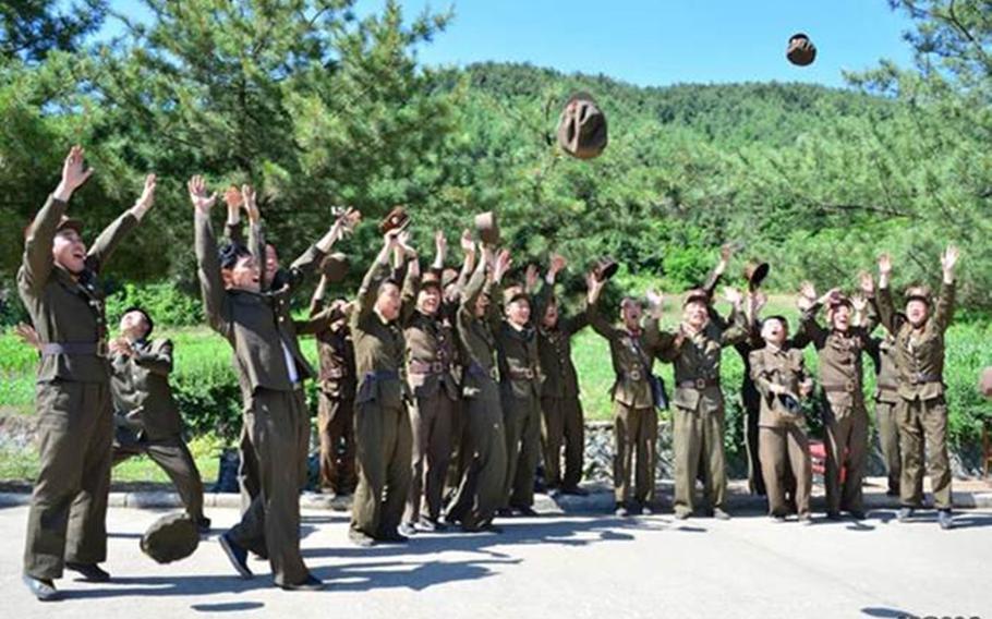 Photos published by the state-run Korean Central News Agency purportedly show North Korean soldiers celebrating after what the communist state claims was its first successful test of an intercontinental ballistic missile on Tuesday, July 4, 2017. 