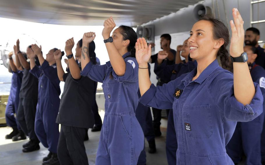 Royal New Zealand Navy sailors assigned to the HMNZS Te Kaha perform a traditional New Zealand song and dance for the sailors of the USS Nimitz Carrier Strike Group in the Philippine Sea, July 2, 2017. 