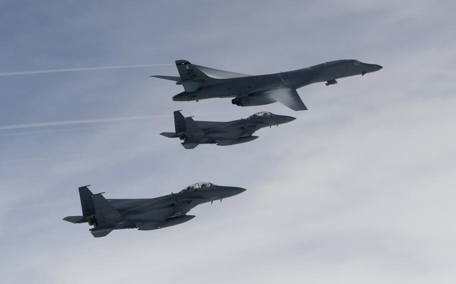 U.S. Air Force B-1B Lancers assigned to the 9th Expeditionary Bomb Squadron, deployed from Dyess Air Force Base, Texas, fly with South Korean F-15 fighter jets over the Korean Peninsula, Friday, July 7, 2017.