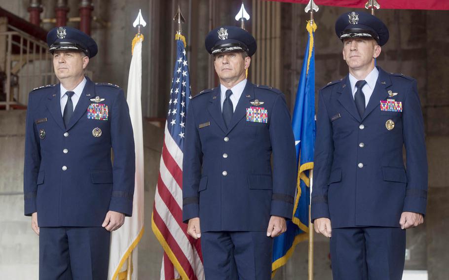 U.S. Forces Japan and 5th Air Force Commander Lt. Gen. Jerry Martinez, left, presides over the 18th Wing change of command from Brig. Gen. Barry Cornish, center, to Brig. Gen. Case Cunningham at Kadena Air Base, Japan, July 10, 2017.