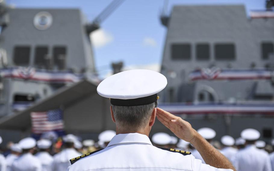 The crew of the Navy's newest Arleigh Burke-class guided-missile destroyer, the USS John Finn, brings the ship to life during its commissioning ceremony in Pearl Harbor, Hawaii, Saturday, July 15, 2017.