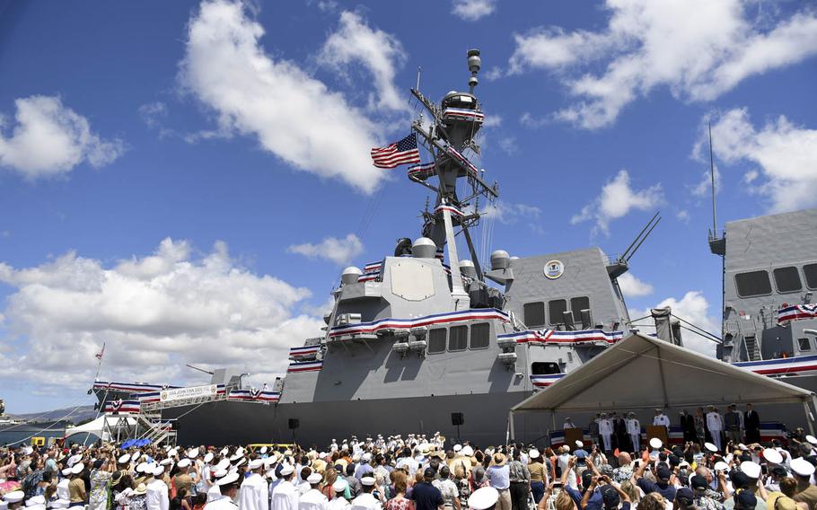 The crew of the Navy's newest Arleigh Burke-class guided-missile destroyer, the USS John Finn, brings the ship to life during its commissioning ceremony in Pearl Harbor, Hawaii, Saturday, July 15, 2017. 