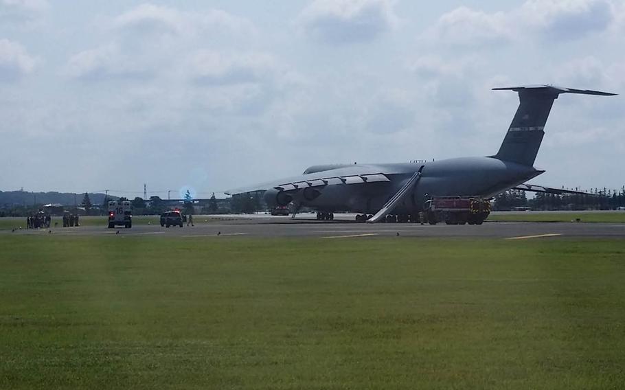 Because of brake failure, a C-5 Galaxy cargo jet, the largest aircraft in the Air Force's inventory, was evacuated before takeoff at Yokota Air Base, Japan, Thursday, July 20, 2017.