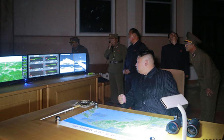 North Korean leader Kim Jong Un observes what this undated Korean Central News Agency photo purports to be an intercontinental ballistic missile launch late Friday, July 28, 2017. 