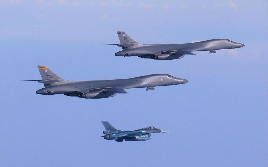 Two Guam-based Air Force B-1B Lancers assigned to the 9th Expeditionary Bomb Squadron, deployed from Dyess Air Force Base, Texas, fly over the Korean Peninsula, Sunday, July 30, 2017.