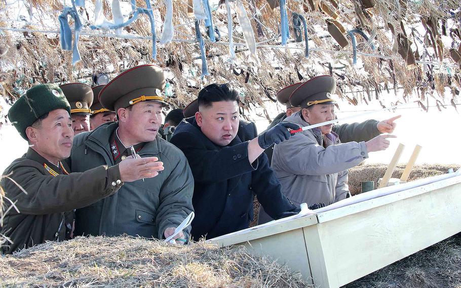 North Korea leader Kim Jong Un visits the Wolnae-do Defence Detachment on the western front line in this photo released by KCNA news agency on March 12, 2013.