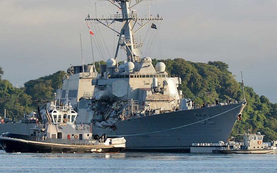 The Arleigh Burke-class guided-missile destroyer USS Fitzgerald (DDG 62) moves to Dry Dock 4 on July 11, 2017, at Fleet Activities Yokosuka to continue repairs and assess damage sustained from its June 17 collision with a merchant vessel.