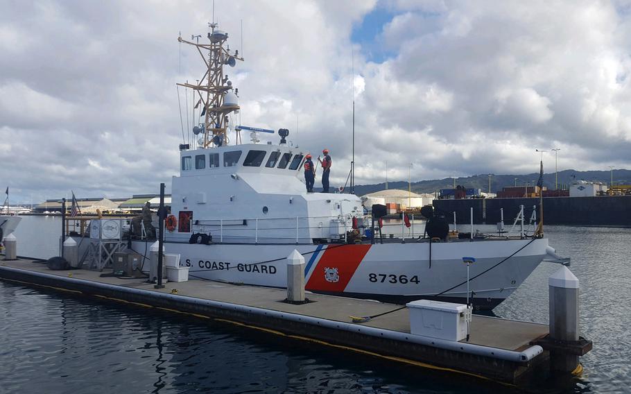 The Coast Guard Cutter Ahi, an 87-foot patrol boat, returns to Coast Guard Base Honolulu after searching throughout the night for five crew members aboard a downed Army UH-60 Black Hawk helicopter off Ka’ena Point, Oahu, Aug. 17, 2017. 