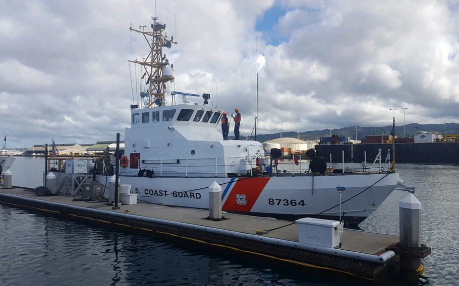 The Coast Guard Cutter Ahi, an 87-foot patrol boat, returns to Coast Guard Base Honolulu after searching throughout the night for five crew members aboard a downed Army UH-60 Black Hawk helicopter off Ka’ena Point, Oahu, Aug. 17, 2017.