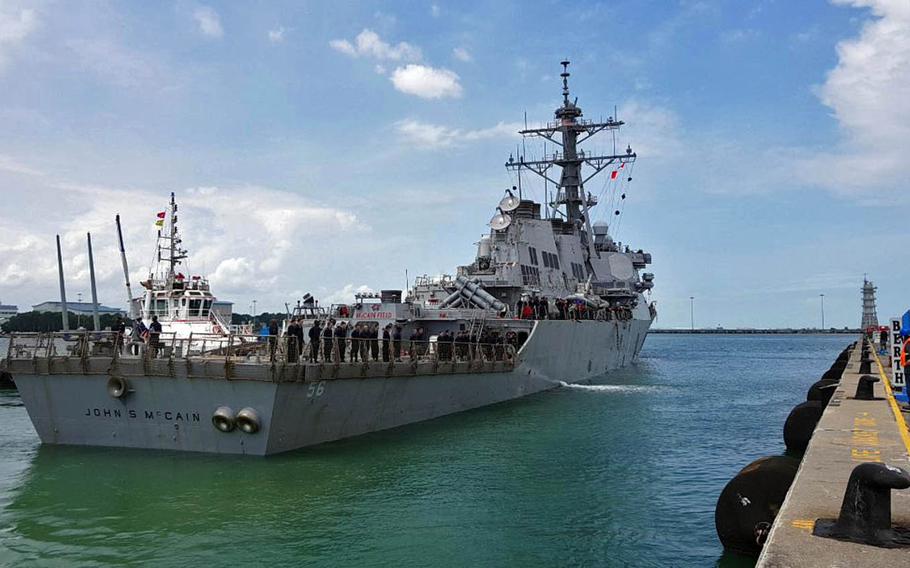 Guided-missile destroyer USS John S. McCain arrives at Changi Naval Base, Singapore, after a collision with a merchant vessel while underway east of the Strait of Malacca, Monday, Aug. 21, 2017.