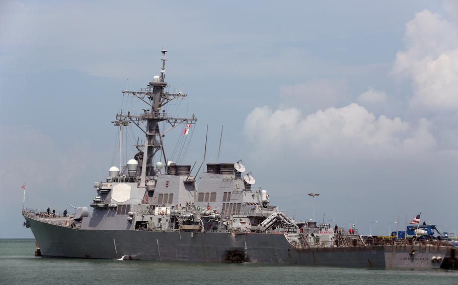 USS John S. McCain (DDG 56) moored pier side at Changi Naval Base, Republic of Singapore, following a collision with the merchant vessel Alnic MC while underway east of the Straits of Malacca and Singapore on Aug. 21.