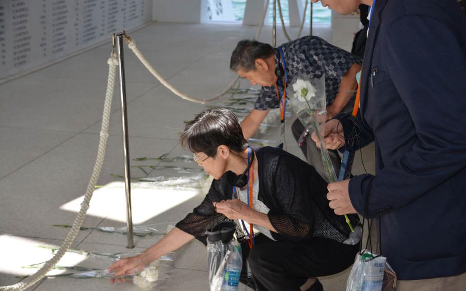 Members of the Japan War-Bereaved Families Association lay flowers on Thursday, Sept. 21, 2017, to honor the 1,177 sailors and Marines from the USS Arizona who died during the Dec. 7, 1941, Japanese surprise attack on Pearl Harbor.