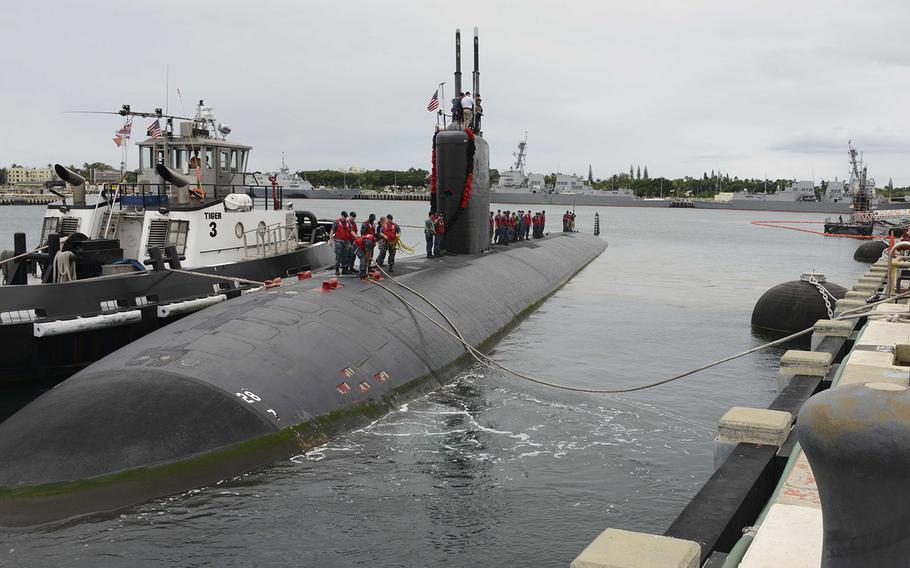 The crew of the Los Angeles-class fast-attack submarine USS Jefferson City prepares to moor pierside at Joint Base Pearl Harbor-Hickam in 2014. 