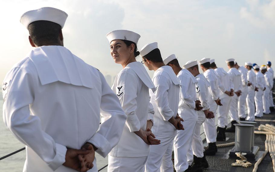 U.S. Navy sailors man the rails aboard the Ticonderoga-class guided-missile cruiser USS Princeton in preparation for pulling into port in Colombo, Sri Lanka on Saturday, Oct. 28, 2017. 