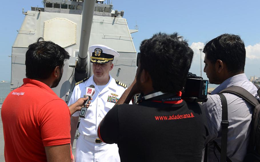 Capt. Justin A. Kubu, commanding officer of the USS Princeton, is interviewed by Sri Lankan news media during a regularly scheduled port visit in Colombo, Sri Lanka on Saturday, Oct. 28, 2017.