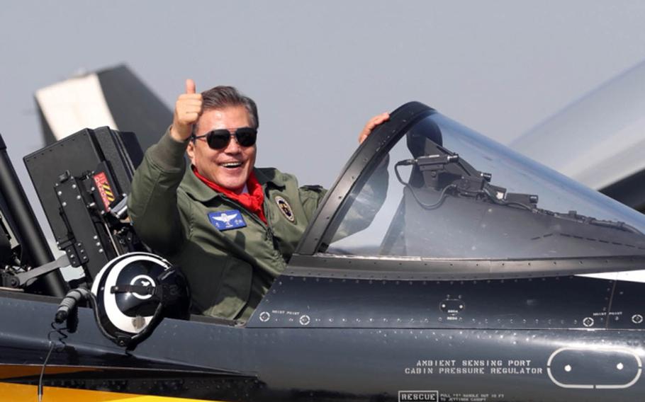 South Korean President Moon Jae-in poses in a T-50 trainer jet, Oct. 17, 2017, the opening day of the Seoul International Aerospace and Defense Exhibition.