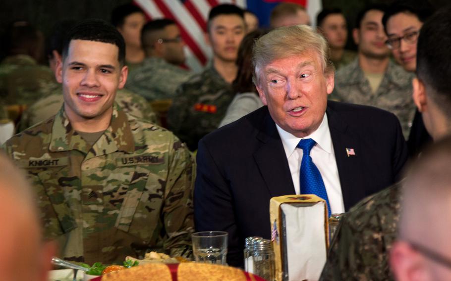 President Donald Trump eats with the troops at Camp Humphreys, South Korea, Tuesday, Nov. 7, 2017. 