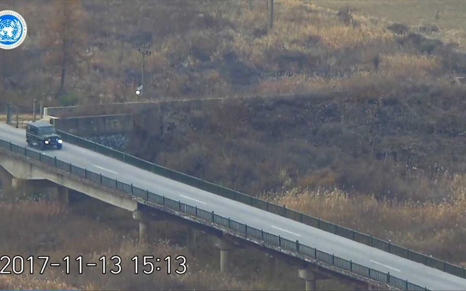 A North Korean defector, presumed to be a soldier, is seen in this still image from a video released by the UNC, driving a military jeep to the line that divides the peninsula, to later rush across it under a hail of gunfire from his former comrades.