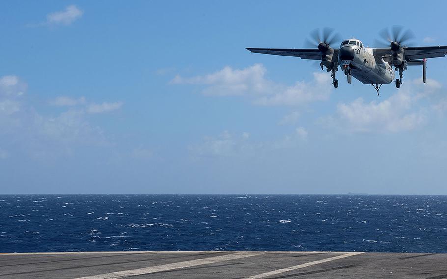 A C-2A Greyhound assigned to the "Providers" of Fleet Logistics Support Squadron (VRC) 30 prepares to land on the flight deck of the aircraft carrier USS Ronald Reagan (CVN 76) in the Pacific Ocean on July 3, 2017. 