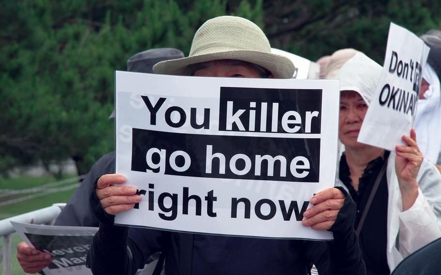 Approximately 2,000 protesters rallied in front of the gate at Marine Corps headquarters at Camp Foster last year to protest the U.S. military presence in Okinawa after a former U.S. Marine who worked as a civilian on Kadena Air Base confessed to the brutal slaying of a 20-year-old woman.