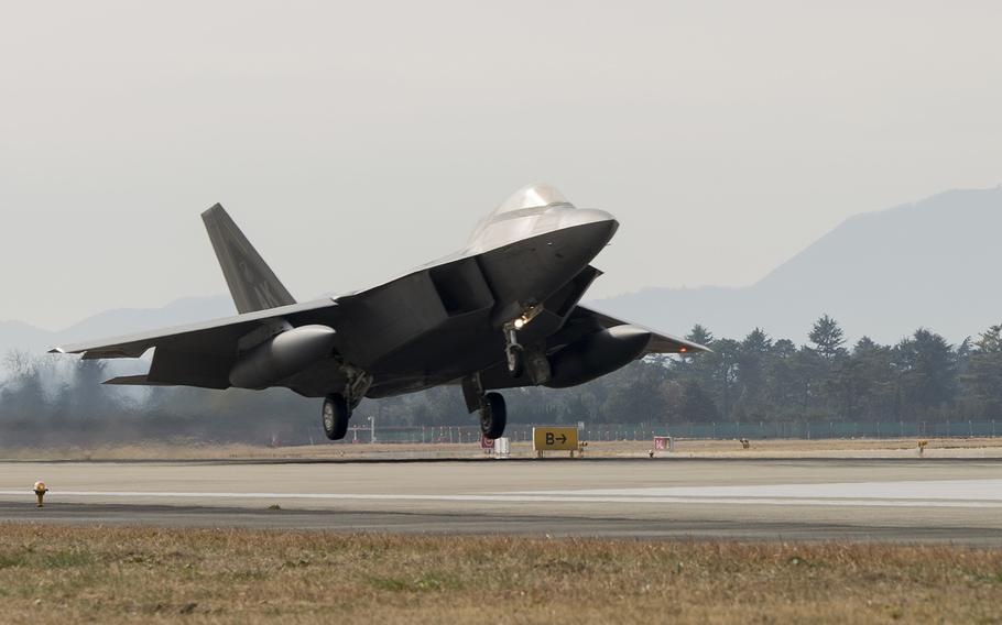 An F-22 Raptor touches down at Gwangju Air Base, South Korea, to take part in Vigilant Ace drills, Saturday, Dec. 2, 2017.