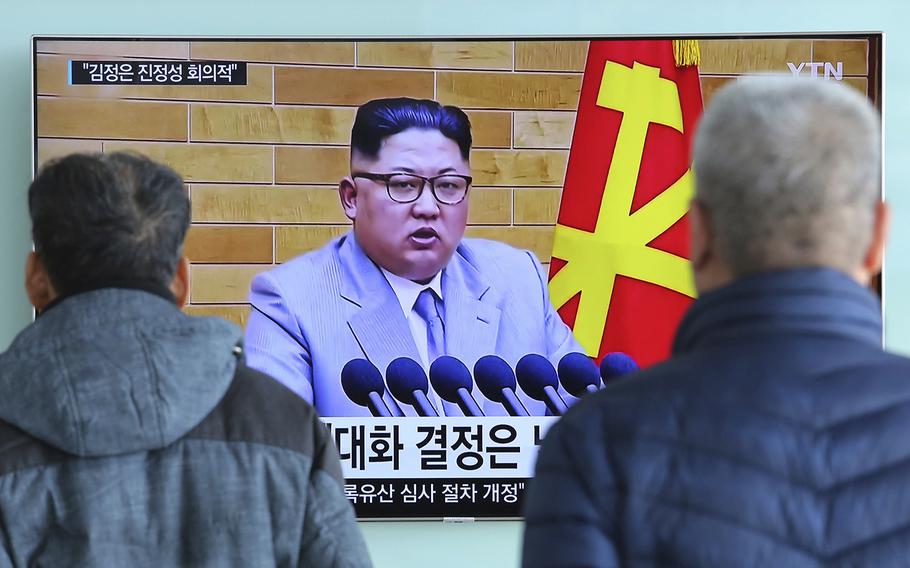 People watch a TV screen showing North Korean leader Kim Jong Un's New Year's speech, at Seoul Railway Station in Seoul, South Korea, Wednesday, Jan. 3, 2018.
