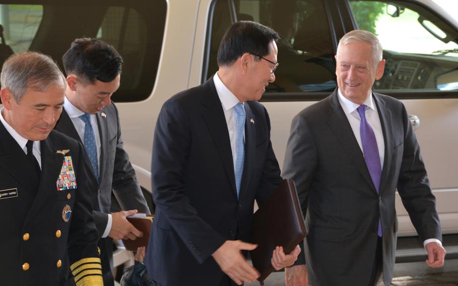 Defense Secretary James Mattis, right, greets South Korean Defense Minister Song Young-moo as he arrives at U.S. Pacific Command headquarters in Hawaii, Friday, Jan. 26, 2018. PACOM commander Adm. Harry Harris, left, joined the defense chiefs for talks that included security for the upcoming Winter Olympics in South Korea.