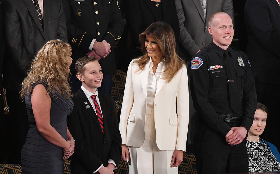 First lady Melania Trump and guests attend the State of the Union address before a joint session of Congress on Capitol Hill in Washington, D.C., on Tuesday, Jan. 30, 2018. Preston Sharp, to the left of Trump, makes an effort to visit a cemetery once a week and place a flag and flower on every veteran's grave.