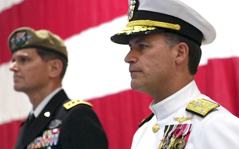 Vice Adm. John Aquilino, right, and Gen. Joseph L. Votel stand at attention during a change-of-command ceremony for U.S. Naval Forces Central Command/U.S. 5th Fleet/Combined Maritime Forces at Manama, Bahrain, in September 2017.