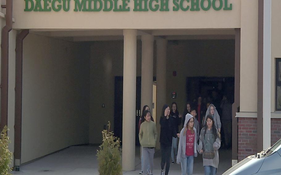 Daegu Middle High School students stage a walkout at Camp Walker, South Korea, Wednesday, March 14, 2018.