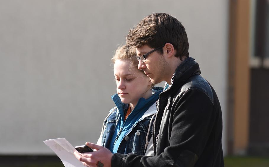 Kaiserslautern High School seniors Madeline MacMillan and Zaccary O’Neil, who organized the walkout at their school, read the names of the 17 victims of the Parkland, Fla., school shooting during a ceremony outside the school on Wednesday, March 14, 2018. 
