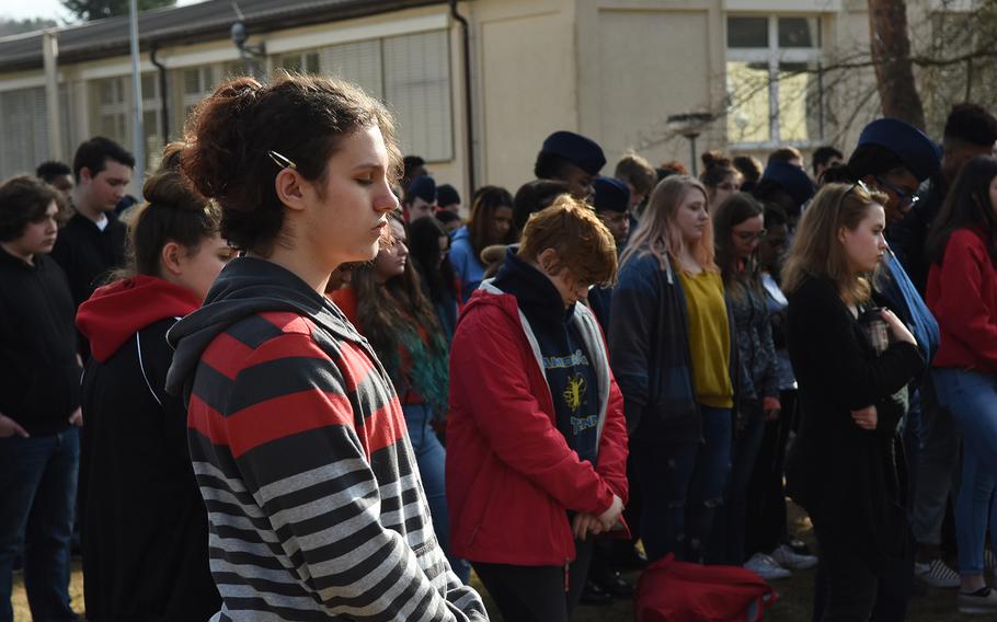 Students at Kaiserslautern High School, Germany, observe a moment of silence for each of the 17 victims of the Parkland, Fla., school shootings during a walkout Wednesday, March 14, 2018. 

