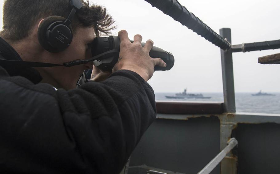 A sailor stands lookout watch on the guided-missile destroyer USS Barry during Foal Eagle drills last year off the Korean Peninsula.