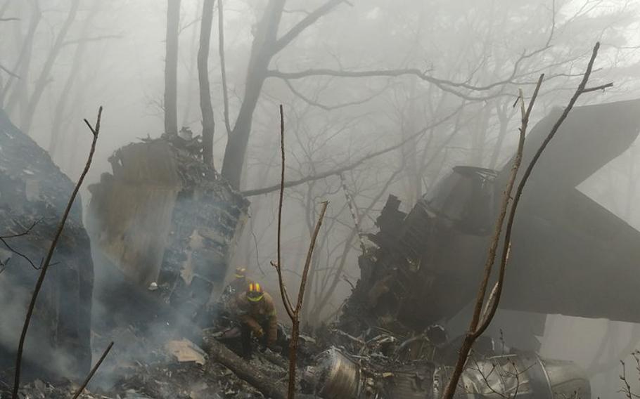 The wreckage of a crashed South Korea's air force F-15K fighter jet remain at a mountain in Chilgok, South Korea, Thursday, April 5, 2018.