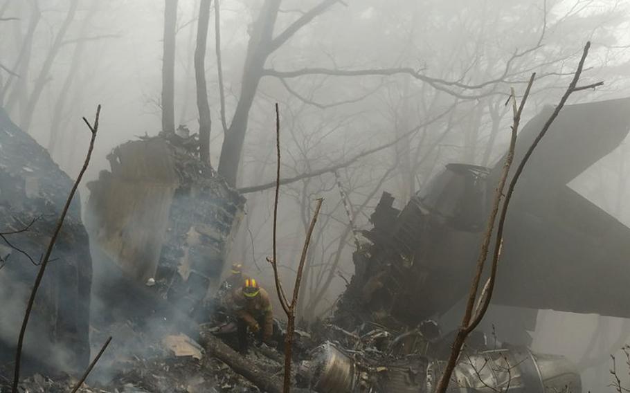 The wreckage of a crashed South Korea's air force F-15K fighter jet remain at a mountain in Chilgok, South Korea, Thursday, April 5, 2018. 