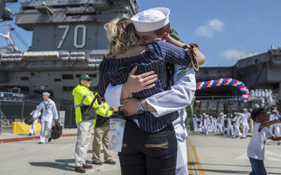 Airman Dustin Thornton, from Jacksonville, Fla., assigned to Nimitz-class aircraft carrier USS Carl Vinson, reunites with his wife at the ship’s homecoming ceremony in San Diego on April 12, 2018.