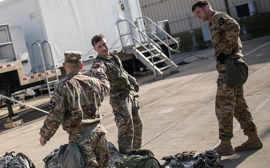 Command Sgt. Maj. Phil Barretto shares fist bumps during the 2nd Infantry Division's Best Warrior competition at Camp Casey, South Korea, Thursday, April 12, 2018.