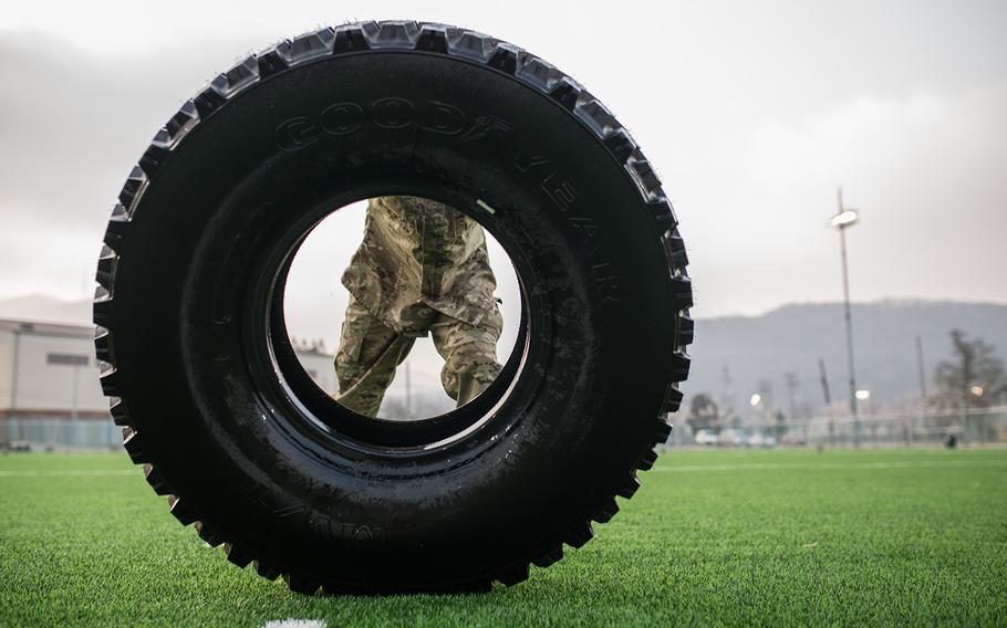 A soldier pushes a tire during the 2nd Infantry Division's Best Warrior competition at Camp Casey, South Korea, Wednesday, April 11, 2018. 