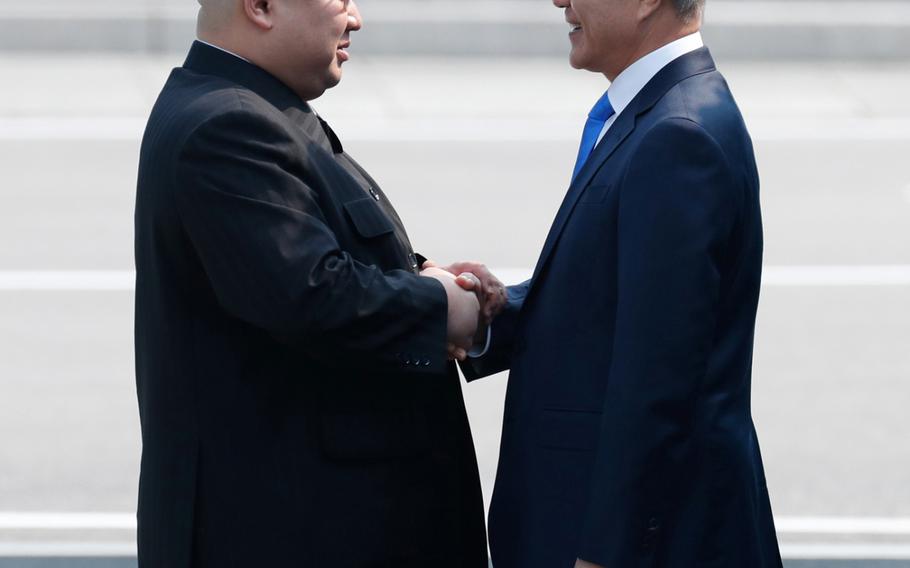 North Korean leader Kim Jong Un shakes hands with South Korean President Moon Jae-in Friday, April 27, 2018 as the two leaders began a historic summit aimed at ridding the communist state of its nuclear weapons. 