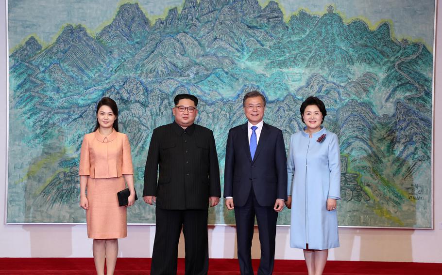 North Korean leader Kim Jong Un and North Korean first lady Ri Sol-ju, left, pose for photos with South Korean President Moon Jae-in and South Korean first lady Kim Jung-sook during the Inter-Korean Summit on Friday, April 27, 2018. 

