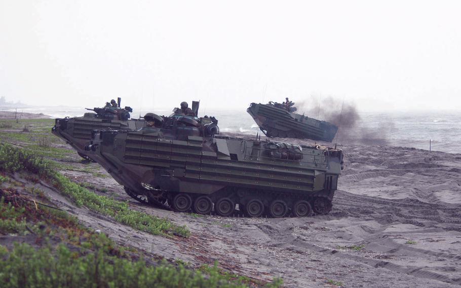 U.S. and Philippine Marines land on a beach in amphibious-assault vehicles during a past drill on the island of Luzon, Philippines.