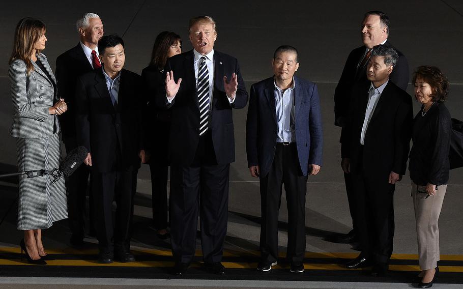 President Donald Trump greets the three Americans freed from North Korea upon their arrival at Andrews Air Force Base outside Washington early Thursday morning, May 10, 2018 in Maryland.