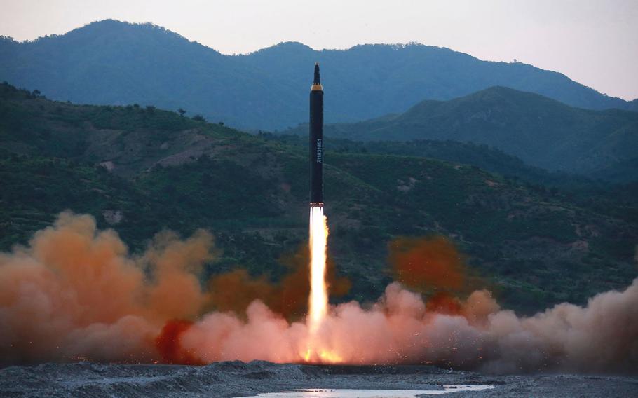 This May 14, 2017, photo distributed by the North Korean government shows the "Hwasong-12," a new type of ballistic missile at an undisclosed location in North Korea. 