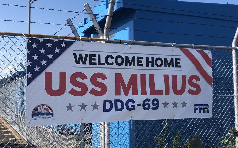 A sign welcomes the destroyer USS Milius to its new homeport at Yokosuka Naval Base on Tuesday, May 22, 2018.