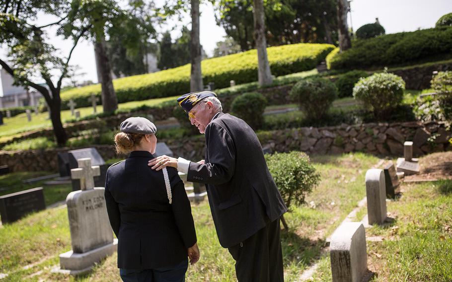 Chris Vaia, vice commander American Legion Post 38 talks to a JROTC cadet at Yanghwajin Cemetery in Seoul, South Korea, Monday, May 28, 2018. 